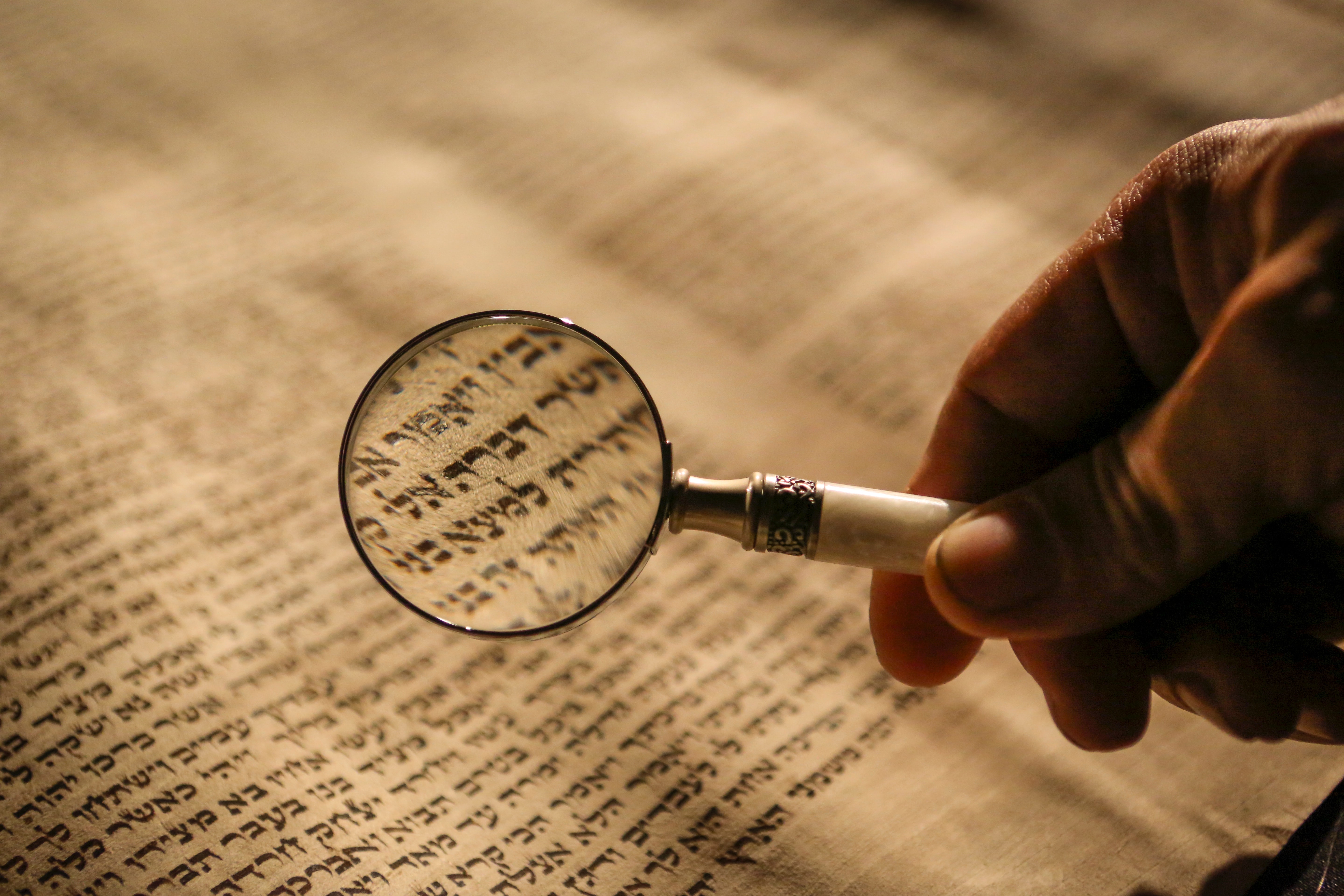 scroll and magnifying glass